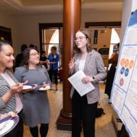 Katie (right) presenting to guests at the 2023 Graduate Showcase.